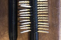 When the spring is expanded, clothespin halves go into the open gaps. When the spring is taken off the jig, the wood keeps the spring expanded.