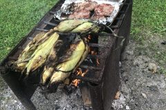 Grilling corn and chops at the campsite